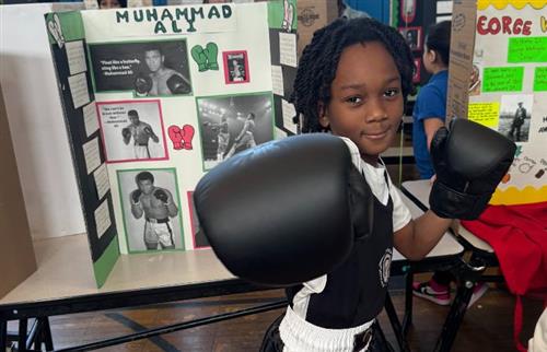  student posing in boxing gear